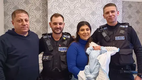 PA Parents Hawsar Hamad and Kale Hamakirm with PC Tom Cannon and PC Dom Taylor