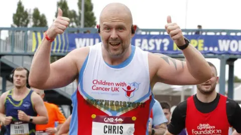 Chris Johnson Chris Johnson with his fists in the air and a big smile on his face 