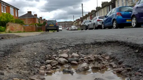 Jamie Niblock/BBC A pothole on an Ipswich road 