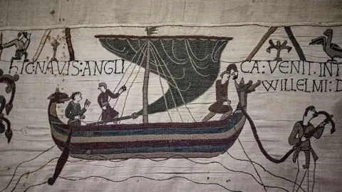 This photograph shows a detail of Bayeux Tapestry before being placed in a crate for transfer to the British Museum, at the Bayeux Tapestry Museum, in Bayeux, northwestern France, on September 18, 2025