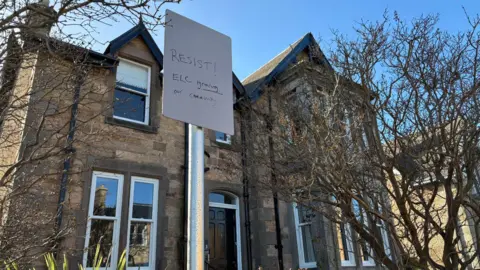 A defaced parking sign in North Berwick