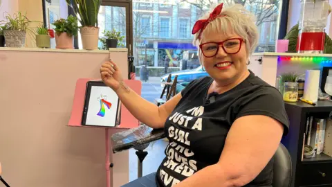 Joshua Cook/BBC Ali Thomson with her new Shed Seven tattoo