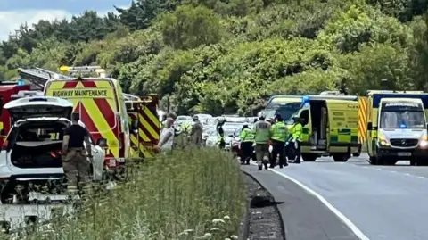 David Jennings Emergency services vehicles and personnel on the A34 dual carriageway, with stopped cars in the background