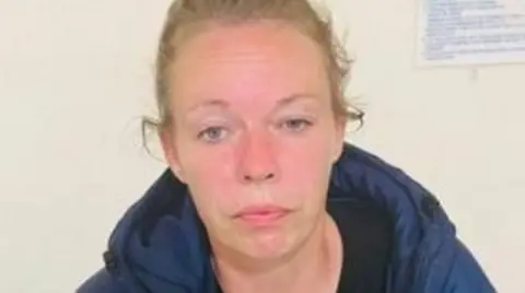 Charlene Hobbs seen wearing a blue jacket, and with her blonde hair tied back. 
