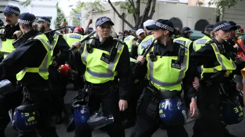 Getty Images Police officers are seen at Notting Hill Carnival on August 25, 2024, in London