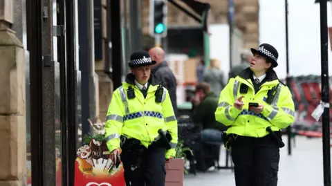 Reuters Police officers patrol Dale Street near the site of an incident where a car plowed into a crowd of Liverpool fans.