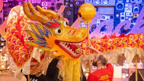 Blackstock Market A gold, orange and red Chinese dragon used in a performance to celebrate Chinese New Year at Blackstock Market in Liverpool.
