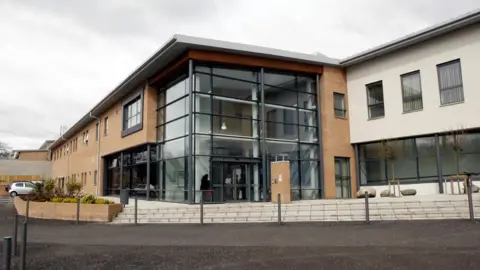 The exterior of a large hospital building