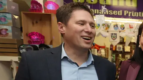 PA Media Matt Carthy smiling with brown hair, looking to the right.