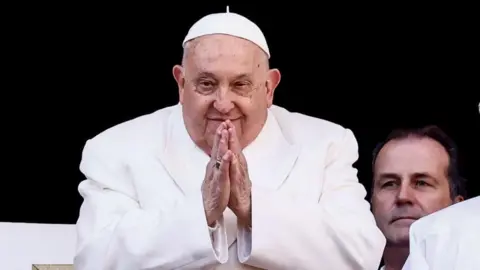 Pope Francis leads the traditional Urbi et Orbi Christmas Day blessing from the central balcony of Saint Peter's Square at the Vatican City, 25 December 2024