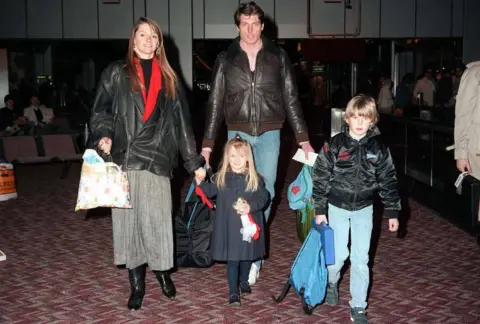 Warner Bros Christopher Reeve and his family photographed in an airport