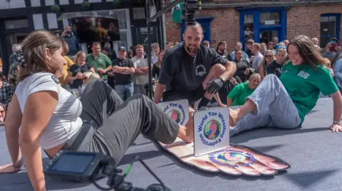 Oddlygood The women's wrestling round at the 2024 Derbyshire toe-wrestling competition