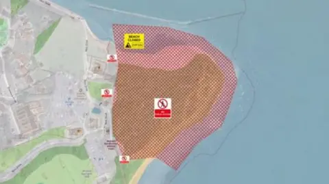 Teignbridge Council A map view of the Ness, Shaldon, with the coastal area highlighted in red as this is the affected area.