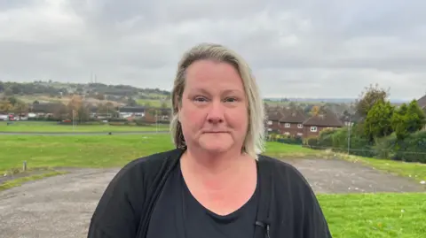 Sam in front of an estate in Bentilee, Stoke-on-Trent 