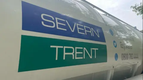 Severn Trent The picture shows a white Severn Trent lorry with the firm's logo on blue and green backgrounds. Some social media information appear next to the logos.
