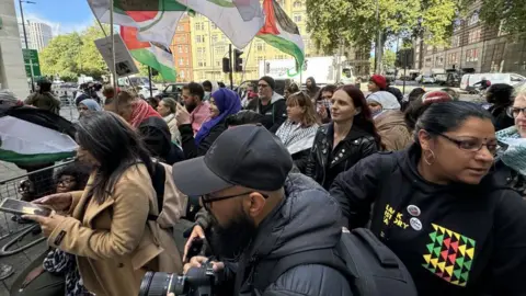 Getty Images A group of demonstrators stage a rally outside the court to show solidarity with Ms Hussain