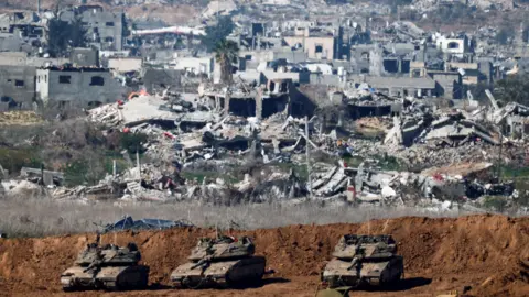 Reuters File photo showing Israeli tanks near the border with Gaza, amid a ceasefire between Israel and Hamas, as seen from Israel (21 January 2025)