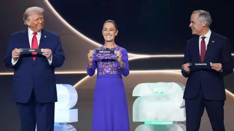 Getty Images US President Donald Trump, Mexican President Claudia Sheinbaum, and Canadian Prime Minister Mark Carney participate in the FIFA World Cup 2026 Official Draw with at the John F. Kennedy Center