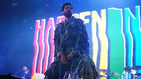 PA Media Serge Pizzorno of Kasabian on stage at Glastonbury 2024