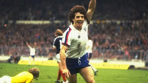 Kevin Keegan celebrates his goal during a match against Scotland at Wembley Stadium in 1979