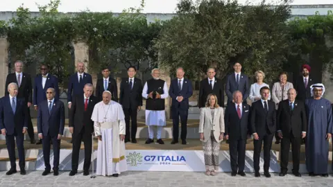 CIRO FUSCO/EPA-EFE/REX/Shutterstock The attendees of the recent G7 summit in Italy