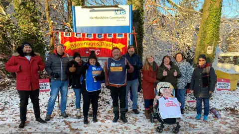 Justin Dealey/BBC The picket line at the Queen Victoria Memorial Hospital in Welwyn