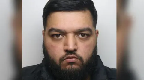 Derbyshire Police A police custody shot of Armaan Afsar