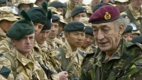 AFP General Sir Mike Jackson (R), Britain's armed forces chief, visits Camp Eagle 4 with some of the British Army Gurkhas of the 1st Battalion, The Royal Irish Regiment (Canterbury) in the northern Kuwaiti desert 07 March 2003.