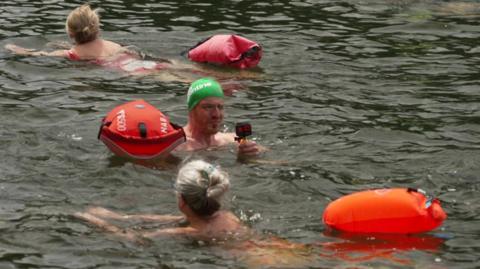People swimming in the River Thames