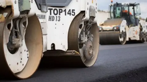 National Highways Steam rolling equipment on freshly laid tarmacadam