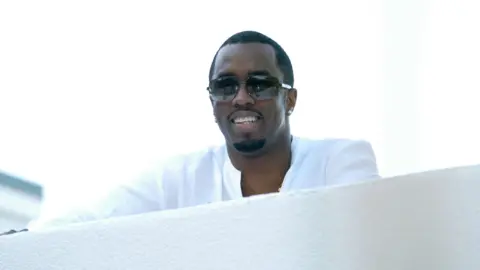 Getty Images Sean "Diddy" Combs smiles at his 2007 White Party event in East Hampton, New York 