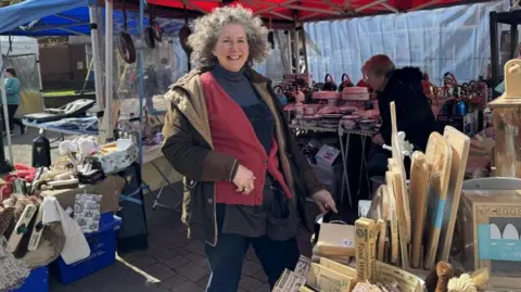 Jane Bundy in the outdoor market