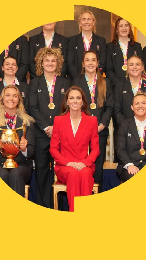 Posed photo of Princess Catherine with the Red Roses. One player is holding the World Cup trophy