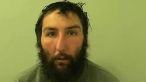 North Yorkshire Police Custody picture of a man with a beard.