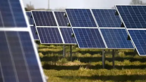 EPA/NEIL HALL Solar panels in a field (stock shot)