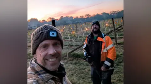Robert Kalisiak camping out with candles in his vineyard