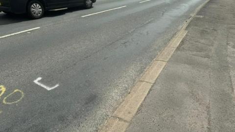 Damaged road surface on Ganstead Lane in Hull