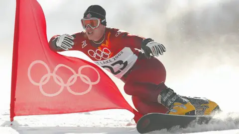 Ryan Wedding of Canada competes in the qualifying round of the men's parallel giant slalom snowboarding event during the Salt Lake City Winter Olympic Games at the Park City Mountain Resort in Park City, Utah.