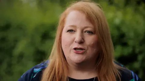 Liam McBurney/PA Wire Justice Minister Naomi Long looking into the camera