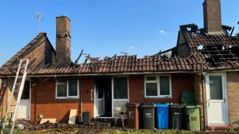 Kate Bradbrook/BBC Harrogate Court in Corby with roofs destroyed by fire damage