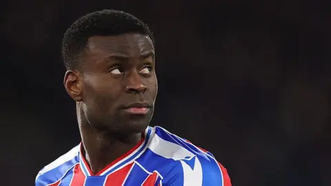 Crystal Palace defender Marc Guehi looking over his shoulder