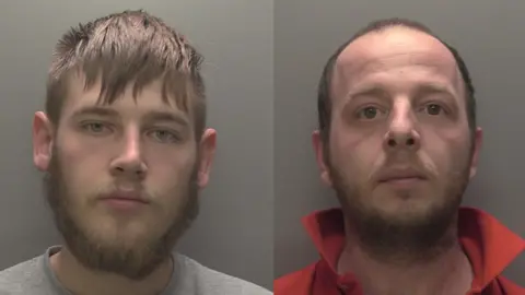 Humberside Police Two side-by-side custody photos of two men looking into the camera. On the left is a man with brown hair, a brown beard and a brown mustache. He is wearing a gray sweater. The man on the right has short brown hair and a short brown beard and mustache. He is wearing a red shirt and his collar is up