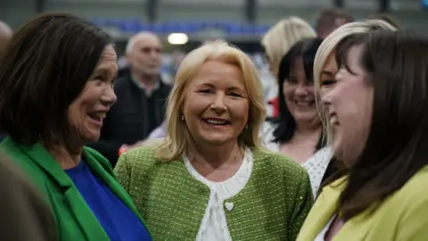 PA Media Mary-Lou McDonald, Pat Cullen and Michelle Gildernew at the general election count centre in Magherafelt