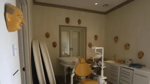 US Congress A room what what looks like a dentist's chair in the middle and masks hanging on the walls