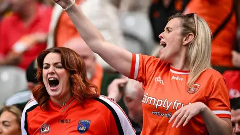 Getty Images/Harry Murphy Two women supporting Armagh GAA during match