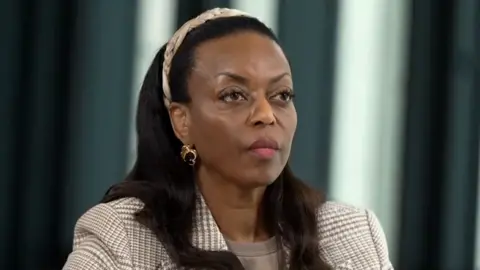 Former Nigeria oil minister Diezani Alison-Madueke, 65, at the BBC for an exclusive interview. She is wearing a jacket with a head-band over long straight hair.
