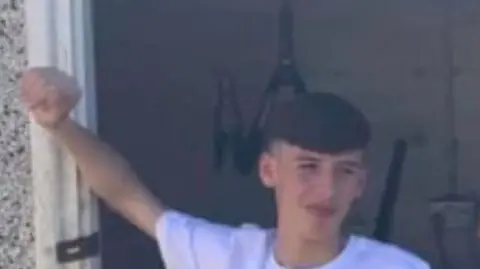 Family handout Two men and woman smiling