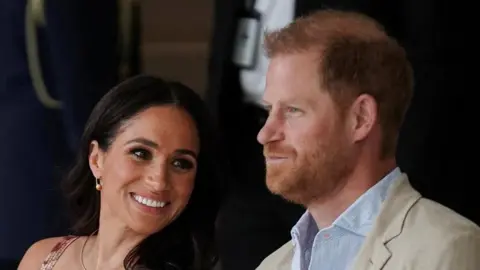 Reuters Britain's Prince Harry sits with his wife Meghan, Duchess of Sussex, as they meet with Colombia's Vice President Francia Marquez.