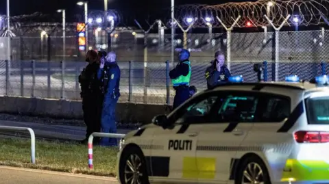 Reuters police outside the airport