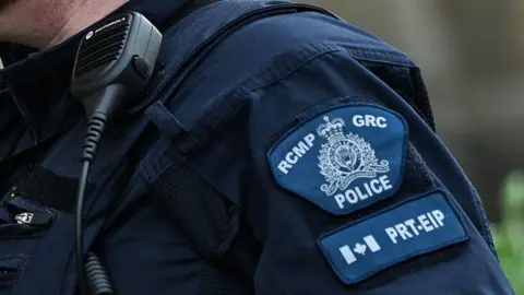 Close-up of the insignia of a Canadian RCMP police officer